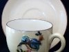 Torquay Pottery Cup and Saucer with applied Bird model