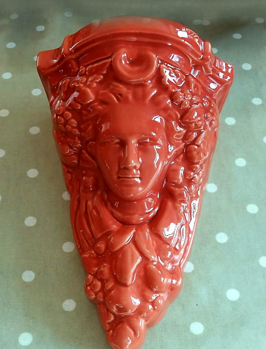 A labelled scarce wall vase