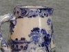 Devon Tors small Jug with a Devon scene on stylised Blue and White pattern, side view, brown clay