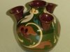 Longpark Pottery Udder Vase with scroll decoration on green ground