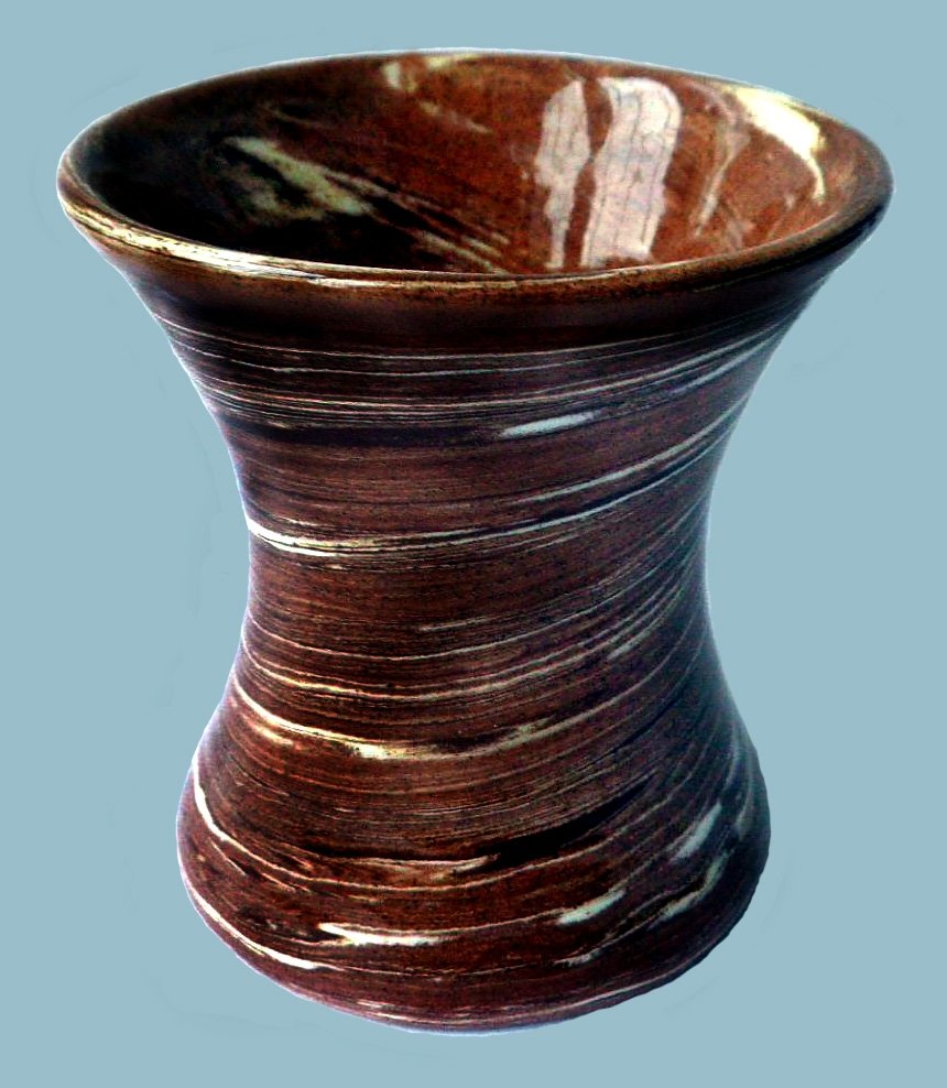 N H Carter marked made from mixed coloured clays.