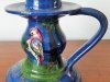 Royal Torquay Pottery an unusual shaped Candleholder with an applied Parrot