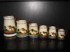 Watcombe Pottery set of graduated Jugs